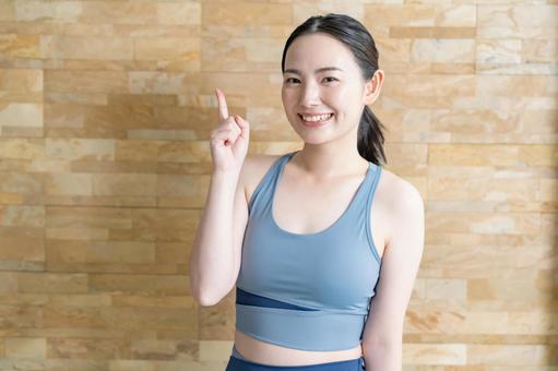 指差しをする女性 ヨガ,フィットネス,ストレッチの写真素材