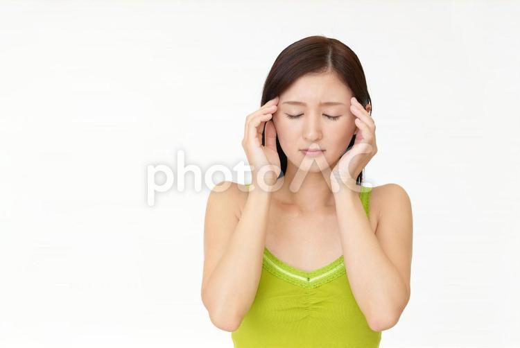 頭痛をうったえる女性 頭痛,女性,女の写真素材