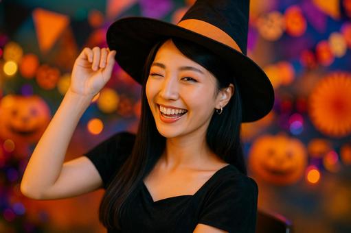 魔女姿でウインク女性 魔女姿でウインク女性の写真