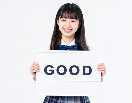Goodと書いたボードを持つ女子生徒 Goodと書いたボードを持つ女子生徒の写真