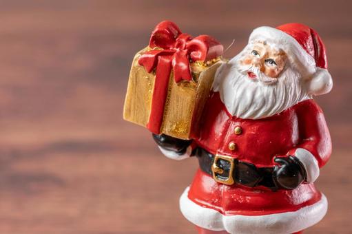 サンタ人形と金色プレゼント サンタクロース,人形,置物の写真素材