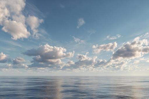 水平線に輝く太陽の光と静かな海 水平線に輝く太陽の光と静かな海の写真