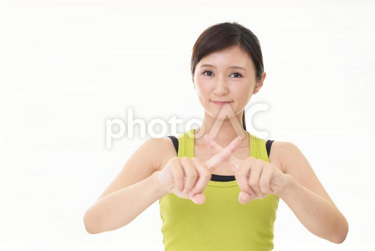 禁止のポーズをとるタンクトップを着た女性 女性,ダイエット,主婦の写真素材