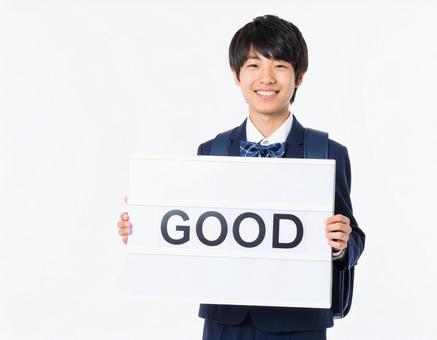 GOODと書いたボードをもつ生徒 GOODと書いたボードをもつ生徒の写真