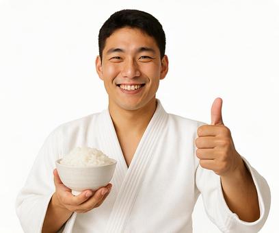 柔道着と茶碗のごはんとサムズアップ 柔道着と茶碗のごはんとサムズアップの写真