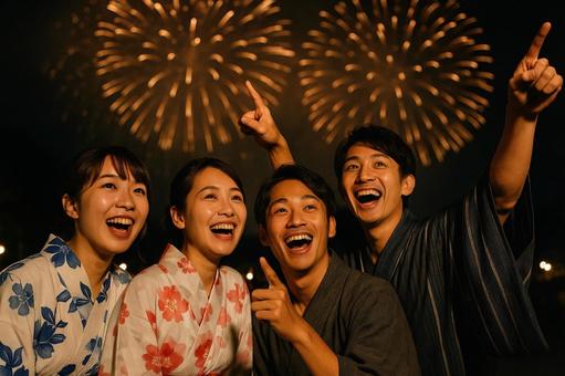 花火に歓声を上げる友人たち 花火に歓声を上げる友人たちの写真