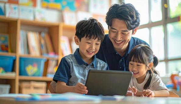 タブレットで遊ぶ保育士と子ども タブレットで遊ぶ保育士と子どもの写真