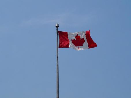 Canadian flag fluttering in the wind, JPG