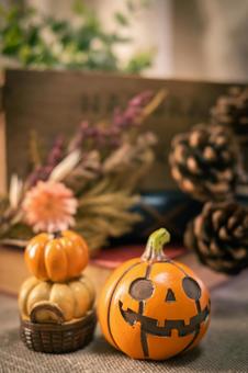 Jack-o'-lantern and pine cones, JPG Jack-o'-lantern and pine cones, JPG