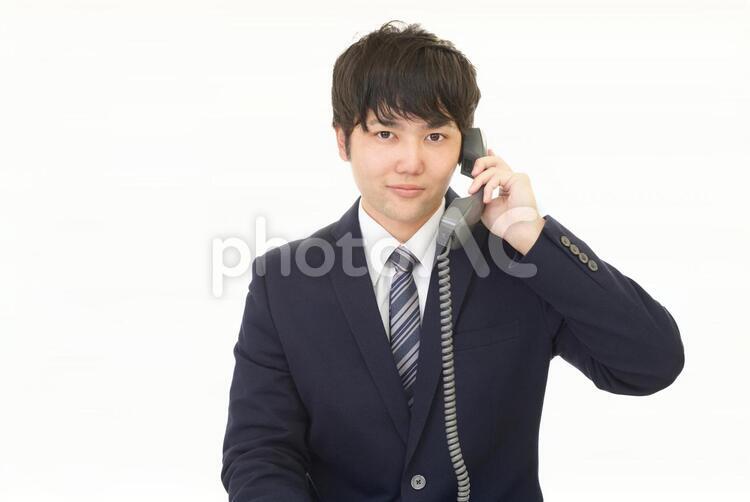 通話中の笑顔のビジネスマン 男性,ビジネスマン,男の写真素材