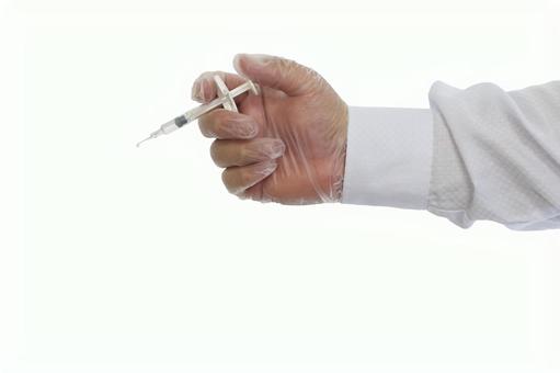注射器を持つ手 注射器を持つ手 注射器を持つ手,注射器,医療用手袋の写真素材
