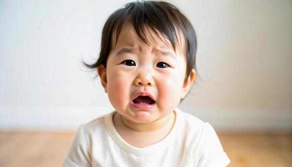 泣く日本人赤ちゃんの顔アップ 泣く日本人赤ちゃんの顔アップの写真