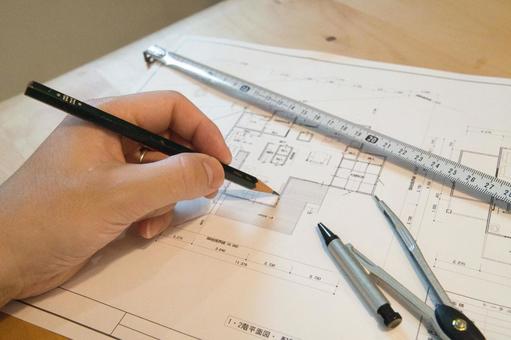 新築注文住宅の間取図を作成中の手元 新築注文住宅の間取図を作成中の手元 設計図,間取り図,計画の写真素材