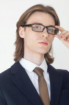 メガネを触るスーツの男性 男性,外国人,欧米人の写真素材