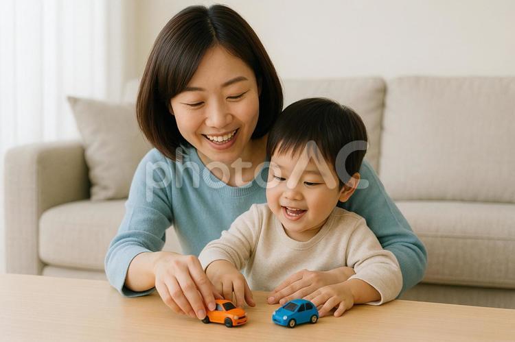 子育て　子供を車のオモチャであやすママ 親子,抱っこ,子供の写真素材
