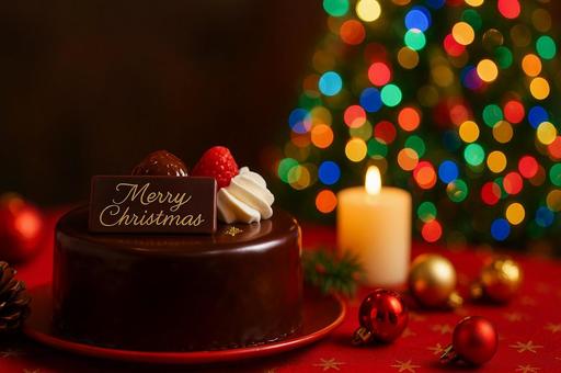 ザッハトルテとキャンドルで彩るクリスマスの写真