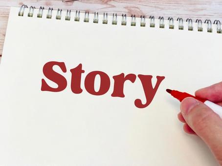 STORYという文字をノートに書く手元 STORYという文字をノートに書く手元 ストーリー,企画,しくみの写真素材