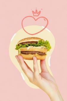 ハンバーガーを持っている人の手元とハートのイラスト 手元,人物,顔なしの写真素材