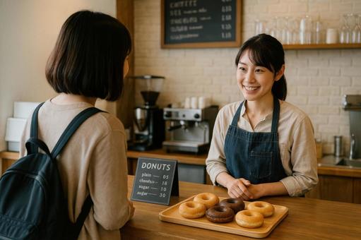 お店のカウンターでドーナツを注文 お店のカウンターでドーナツを注文の写真