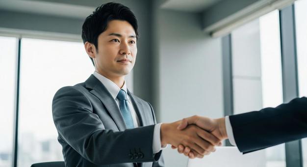 ビジネス握手:男性社員の契約と信頼 ビジネス握手:男性社員の契約と信頼の写真