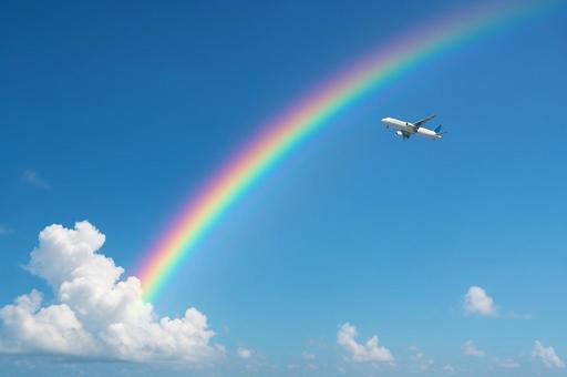 虹と遠くに見える飛行機 虹と遠くに見える飛行機の写真