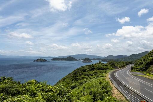 高崎山展望所からの眺望2 高崎山展望所,道路,海の写真素材