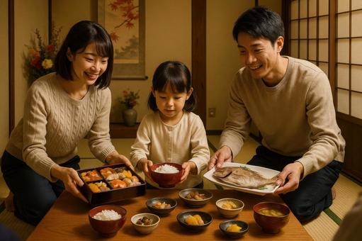 お祝い料理を配膳する家族 お祝い料理を配膳する家族の写真