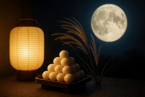 提灯の灯りと満月に照らされた団子の写真