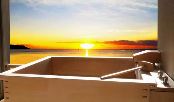 Open-air bath with a view of the setting sun Open-air bath with a view of the setting sun