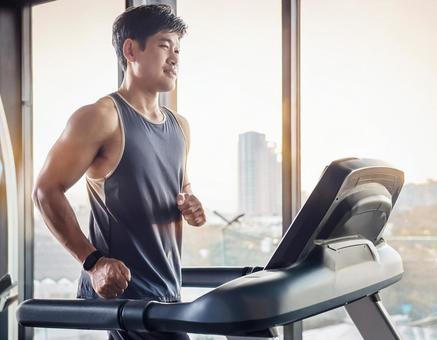 Man training on a running machine, running machine, gym, male, JPG