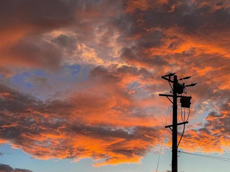 Fiery sunset sky and the silhouette of a utility pole, JPG Fiery sunset sky and the silhouette of a utility pole, JPG