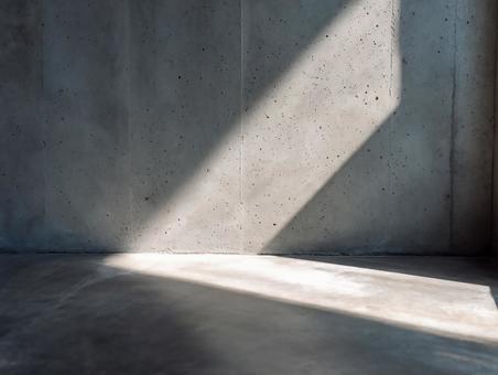 自然光が差し込むコンクリート背景の写真