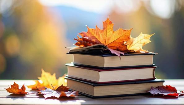 読書の秋 机の上の本 落ち葉の紅葉 読書の秋 机の上の本 落ち葉の紅葉の写真