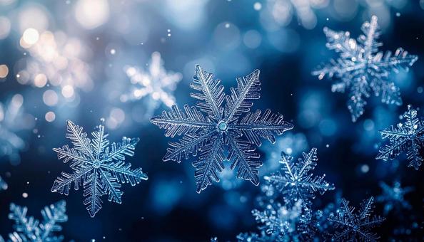 青い背景に浮かぶ雪の結晶 青い背景に浮かぶ雪の結晶の写真