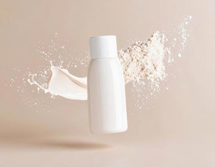 粉と液体の要素を持つ化粧品のボトル 粉と液体の要素を持つ化粧品のボトルの写真