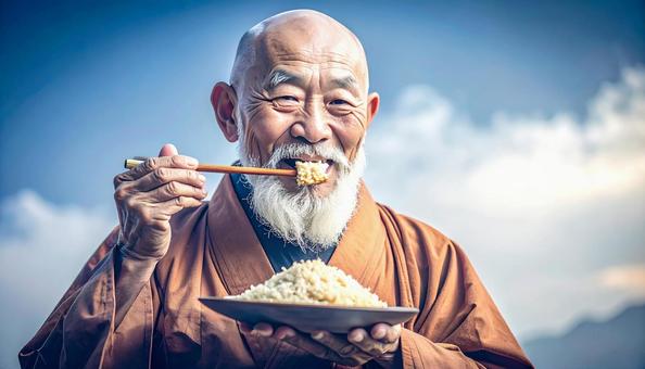 精進料理を食べる老いた僧侶 精進料理を食べる老いた僧侶の写真