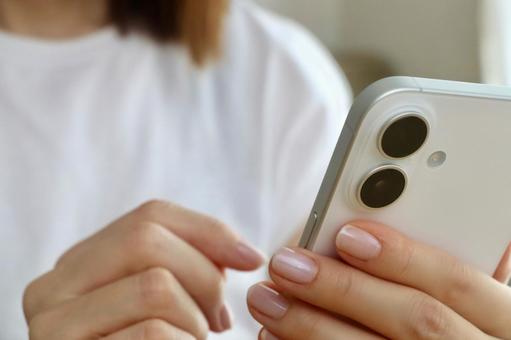 Woman's hand holding a smartphone, JPG Woman's hand holding a smartphone, JPG