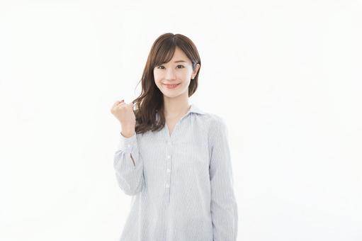 若い女性 ガッツポーズ 若い女性 ガッツポーズの写真