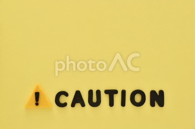 警告マークとcautionの文字 caution,警告マーク,警告の写真素材