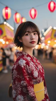 夜祭に遊びに来た赤い浴衣の女性 夜祭に遊びに来た赤い浴衣の女性の写真
