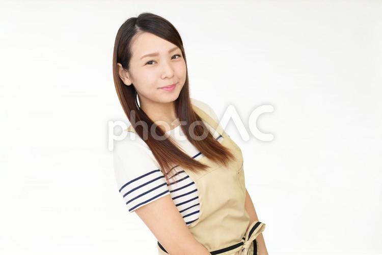 エプロンを着た笑顔の女性 女性,女,主婦の写真素材