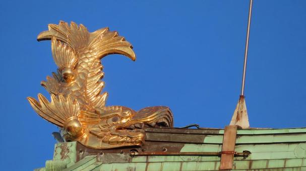 名古屋城　夕日に輝く金のシャチホコ　雄　 名古屋城,尾張徳川家,御三家の写真素材