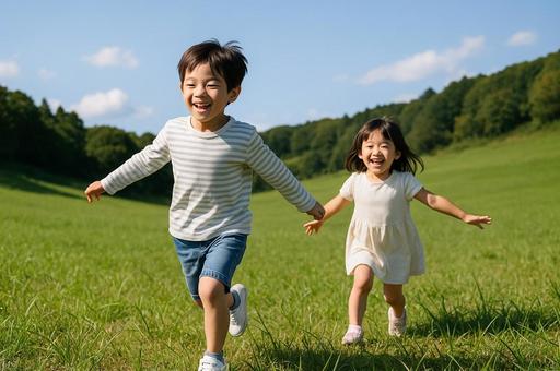 草原で遊ぶ子供たち 草原で遊ぶ子供たちの写真