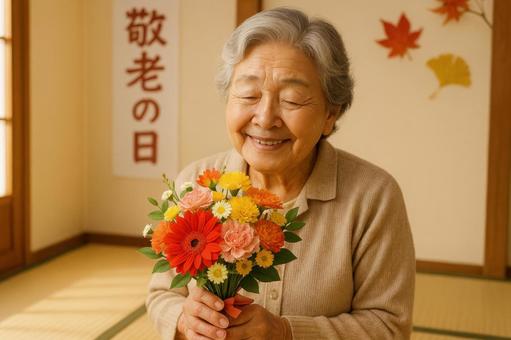 花束を持つ祖母の笑顔 花束を持つ祖母の笑顔の写真