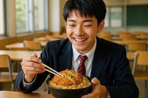 かつ丼大盛りを食べる男子高校生 かつ丼大盛りを食べる男子高校生の写真