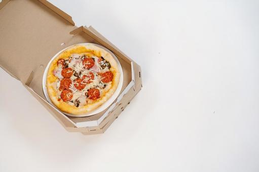 ピザ箱に入っっているピザ 配達,フードデリバリー,デリバリーの写真素材