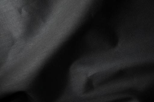 黒布のシワ質感背景の写真