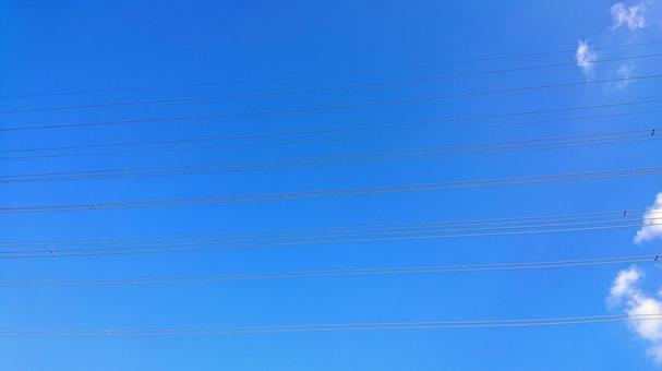 電線と青空の写真