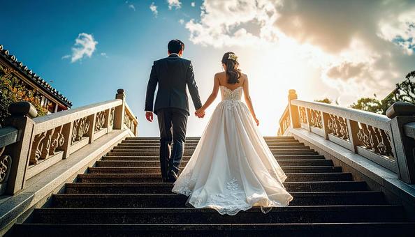 手をつないで階段を上っていく新郎新婦 手をつないで階段を上っていく新郎新婦の写真