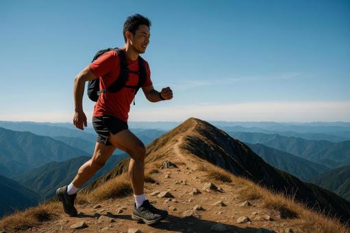 ピークを越えて次の山へ向かうランナー ピークを越えて次の山へ向かうランナーの写真
